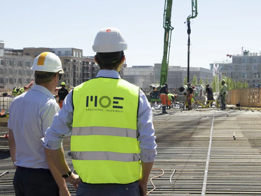 Building owners looking at a construction site and using Tector