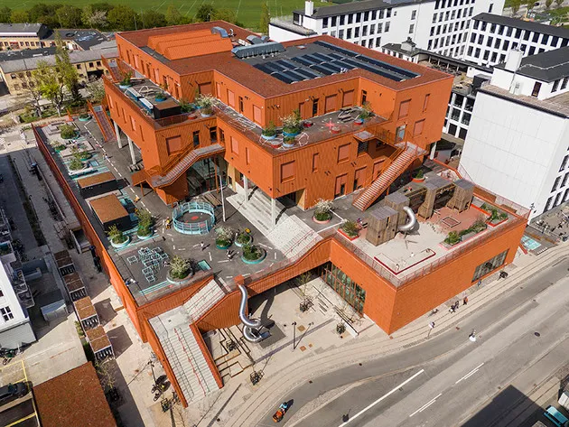 Aerial view of the flat roof of a school building monitored by Tector